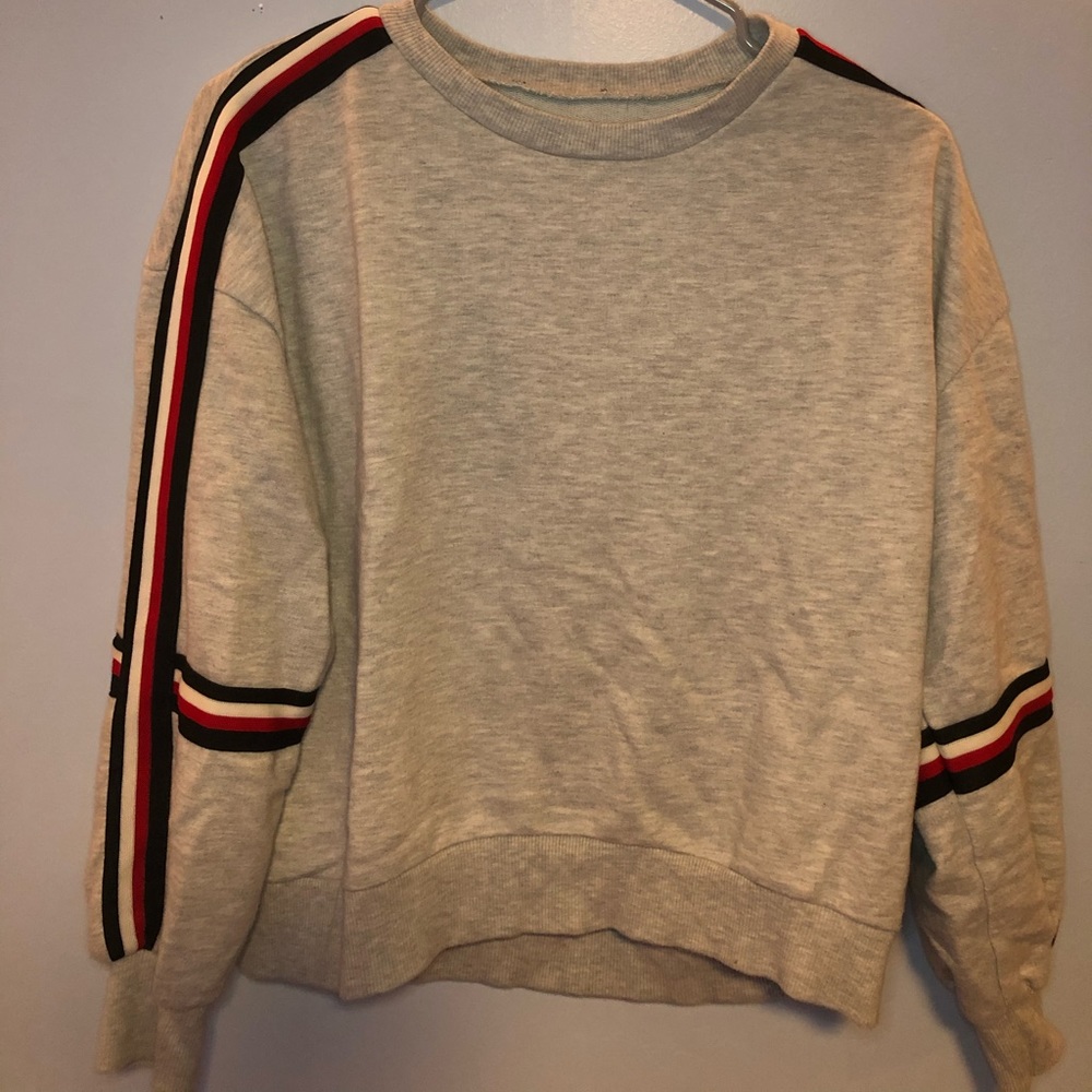 gray sweatshirt with strips down the side
